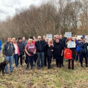Angered residents gather to oppose hundreds of homes being built