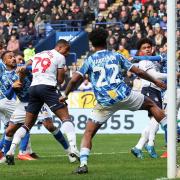 Victor Adeboyejo scores the equalising goal for Bolton against Port Vale.
