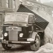 A young Ray Webster inspecting a truck