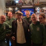 Sir Ian McKellen with staff at The Jolly Farmers pub.