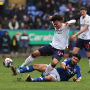 Bolton Wanderers' Shola Shoretire is fouled by Ipswich Town's Massimo Luongo