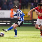Sheffield Wednesday's George Byers and Charlton Atheltic's Scott Fraser (right) battle for the ball during the Sky Bet League One match at The Valley.