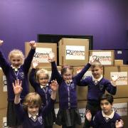 Children at Turton and Edgworth Primary School celebrating their new computers and tablets