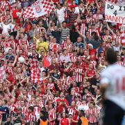 Kevin Davies looks up at Stoke City fans in the 2011 FA Cup semi-final at Wembley