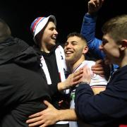 Dion Charles celebrates with the fans after victory against Accrington in the semi final