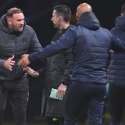 Ian Evatt and Dino Maamria clash on the touchline during Wanderers' 2-1 win against Burton Albion