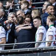 Sharon Brittan hugs Ian Evatt at Wembley after the Papa Johns Trophy final