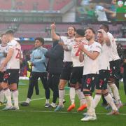 Wanderers players celebrate their Papa Johns Trophy win at Wembley