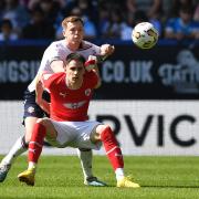 Bolton Wanderers' George Johnston battles with Barnsley's Slobodan Tedic