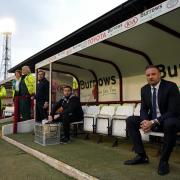 Ian Evatt takes his place in the dugout for Wanderers' play off semi-final second leg
