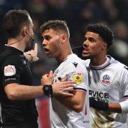 Elias Kachunga pleads with the officials after Dion Charles is wrongly sent off against Forest Green