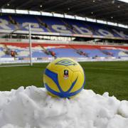 Snow piles up around the pitch before Bolton's FA Cup game with Everton in 2013