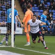 Dion Charles celebrates one of his three goals against Peterborough United last season