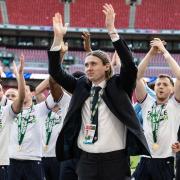 Jon Dadi Bodvarsson leads the Thunderclap in front of the Bolton Wanderers fans at Wembley