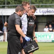 George Johnston is helped from the field after his injury against Bamber Bridge in pre-season