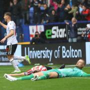 Dion Charles races away after Bolton's third goal of the day against Lincoln