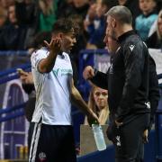 Dion Charles speaks to Pete Atherton after his red card against Fleetwood