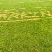 The vandalism at Turton FC's football pitch. It reads 'No Parking'