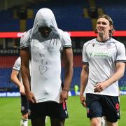 Dan Nlundulu shows off a message on his shirt in tribute to ex team-mate Ben Cull