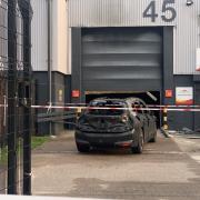 Investigation underway and industrial units taped off following car fire