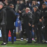Steve Evans and Ian Evatt exchange words on the touchline during the game