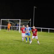 Daisy Hill’s Sam Twist, centre, being shadowed by Bacup’s Mason Fallon and Alex Mellor on Monday night