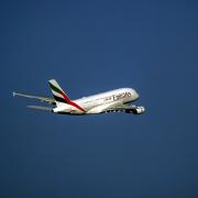 An Emirates flight has landed at Manchester Airport and emergency crews have surrounded it as a suspected 