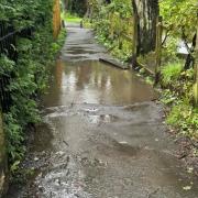 Flooded footpath that leads to Eagley Junior School and Turton High School