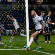 Will Forrester celebrates Eoin Toal's third goal for Bolton