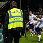 Eoin Toal celebrates a dramatic late winner against Wycombe in front of the Bolton fans
