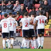 Bolton Wanderers' Randell Williams celebrates scoring his side's first goal with team-mates