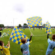 Solihull Moors fans wave flags in their play-off semi-final back in 2022