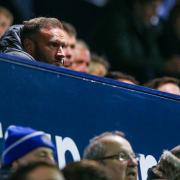 Ian Evatt looks on from the directors' box at Stockport during Tuesday night's win