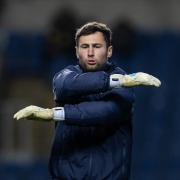 Bolton Wanderers keeper Nathan Baxter in the warm-up at Oxford United