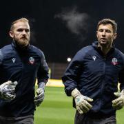 Nathan Baxter right, with Joel Coleman in the warm-up against Oxford United