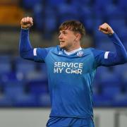 Conor Carty celebrates scoring on his debut for Wanderers at Tranmere