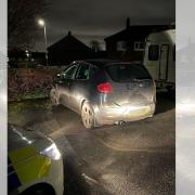Car seized as police hunt for driver who raced away