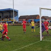 Daisy Hill’s Ryan Talbot (number nine) glances his header just wide in the first half. Picture by Neil Gray