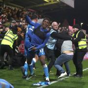 Dapo Afolayan celebrates a winning goal against Fleetwood in November 2022