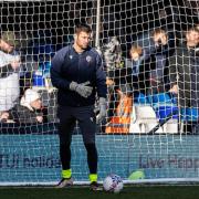 Nathan Baxter warms-up before Sunday's 0-0 draw with Premier League Luton Town