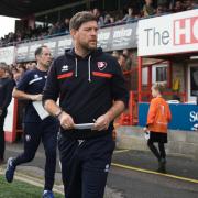 Cheltenham Town manager Darrell Clarke has taken the club off the foot of the table in League One