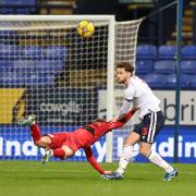 Jack Iredale clears under pressure in Wanderers' 1-0 win against Cheltenham