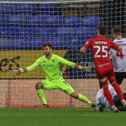 Nathan Baxter watches a late effort from Josh Harrop go wide in Wanderers' 1-0 win against Cheltenham