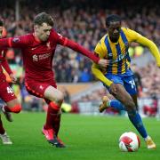 Nathanael Ogbeta in action against Liverpool's Conor Bradley in the FA Cup during his time with Shrewsbury Town