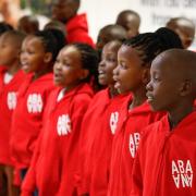Abaana choir performs in Manchester Airport