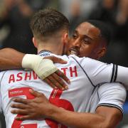 Victor Adeboyejo hugs Zac Ashworth after scoring the opener against Charlton