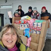 Wendy and a team of volunteers distribute aid and baby boxes