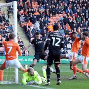 Marvin Ekpieta scores Blackpool's second goal of the day at Bloomfield Road