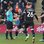 Bolton Wanderers' Gethin Jones reacts as Referee Josh Smith awards a penalty kick