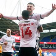 Bolton Wanderers' Aaron Collins celebrates scoring his side's second goal with team-mate Victor Adeboyejo